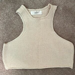Cream cropped sweater material. Cute for fall/ winter activities with friends.
